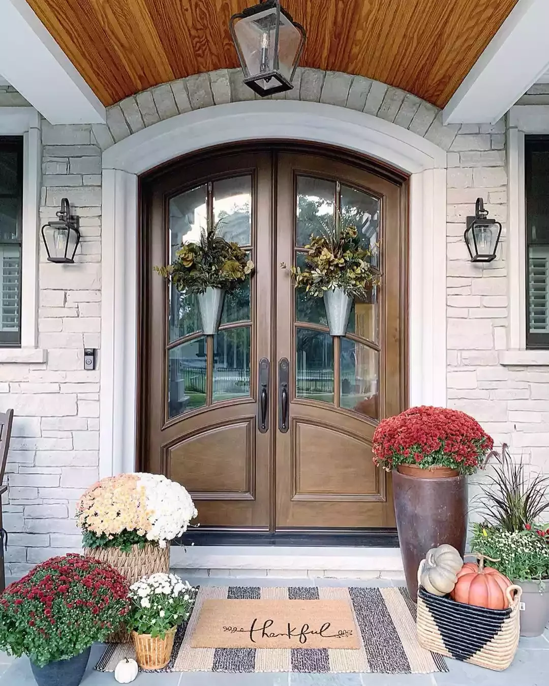 52 Autumn Front Porch Ideas That Will Transform Your Home's Entrance This Fall 10 Hang Floral Arrangements Instead of Wreaths