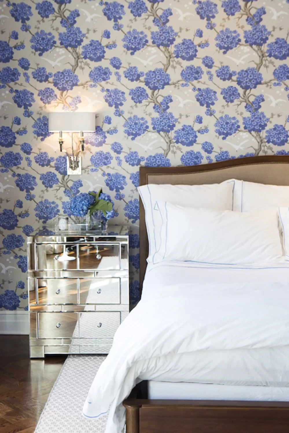 55 Stunning Blue Bedroom Ideas to Transform Your Space Into a Peaceful Haven 52 Hang Floral Wallpaper
