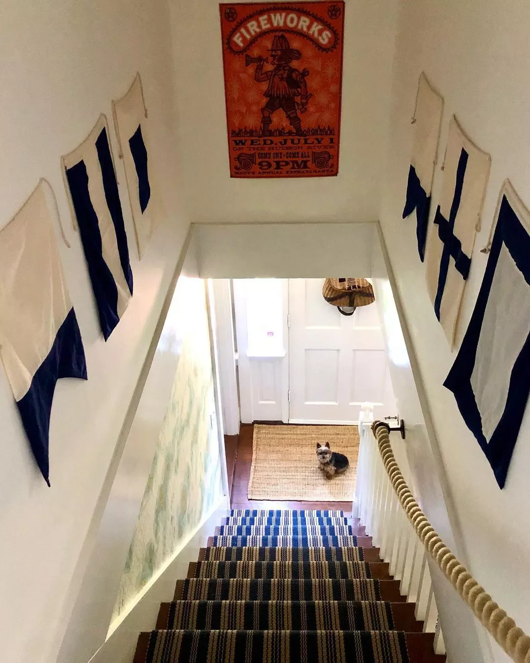 30 Creative Staircase Wall Decorating Ideas That Will Transform Your Space 28 Hang Pennants or Flags