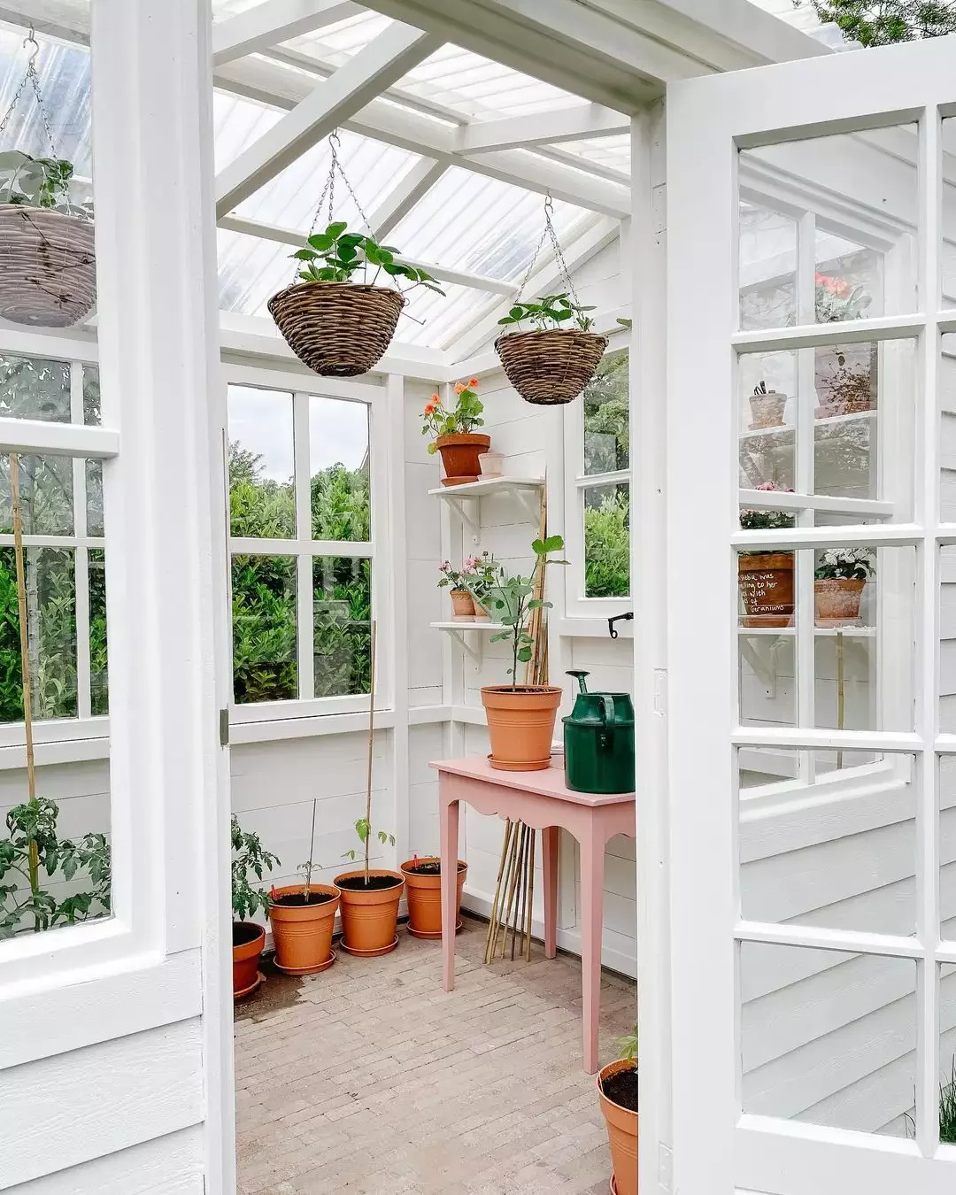 Hang Pretty Wicker Planters From the Greenhouse Ceiling