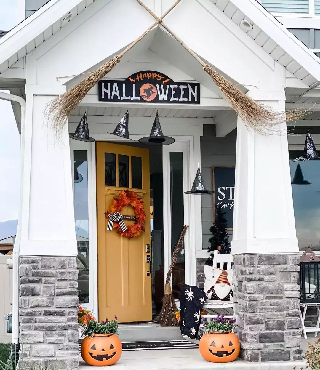33 Spooktacular Halloween Front Porch Ideas That'll Make Your Home the Neighborhood's Must-See Destination 29 Hang Some Witch Brooms