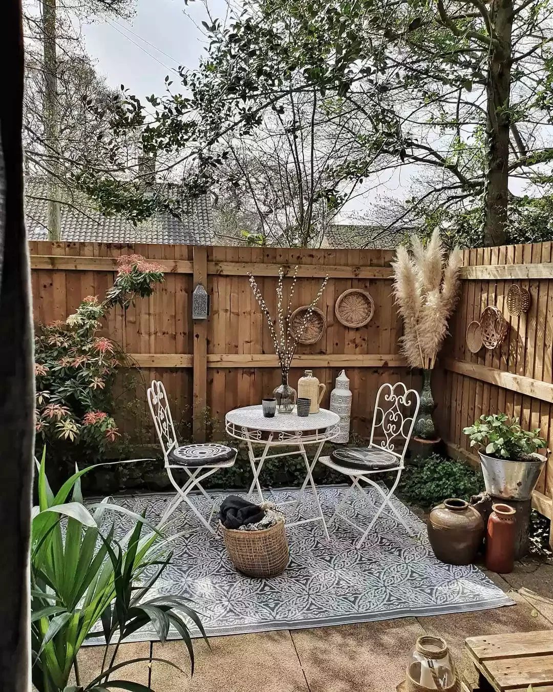 25 Budget Patio Ideas That'll Make Your Neighbors Jealous Hang Wall Baskets on Fencing