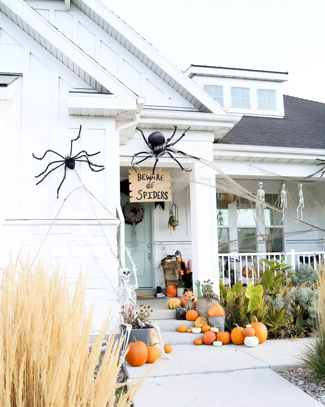 33 Spooktacular Halloween Front Porch Ideas That'll Make Your Home the Neighborhood's Must-See Destination 19 Hang a Beware Sign