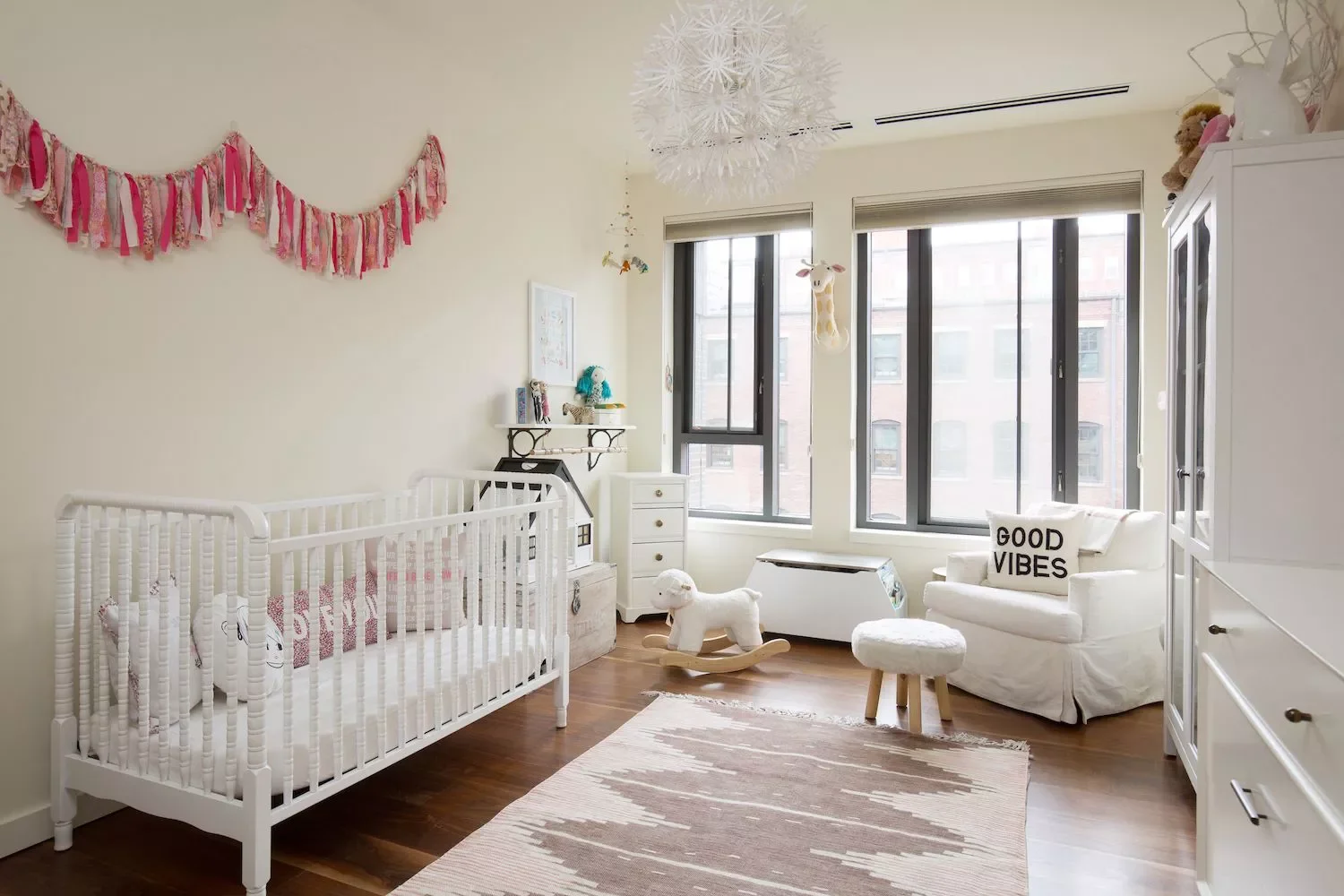 57 Stunning Baby Girl Nursery Ideas That'll Make Your Heart Melt Hang a Colorful Banner
