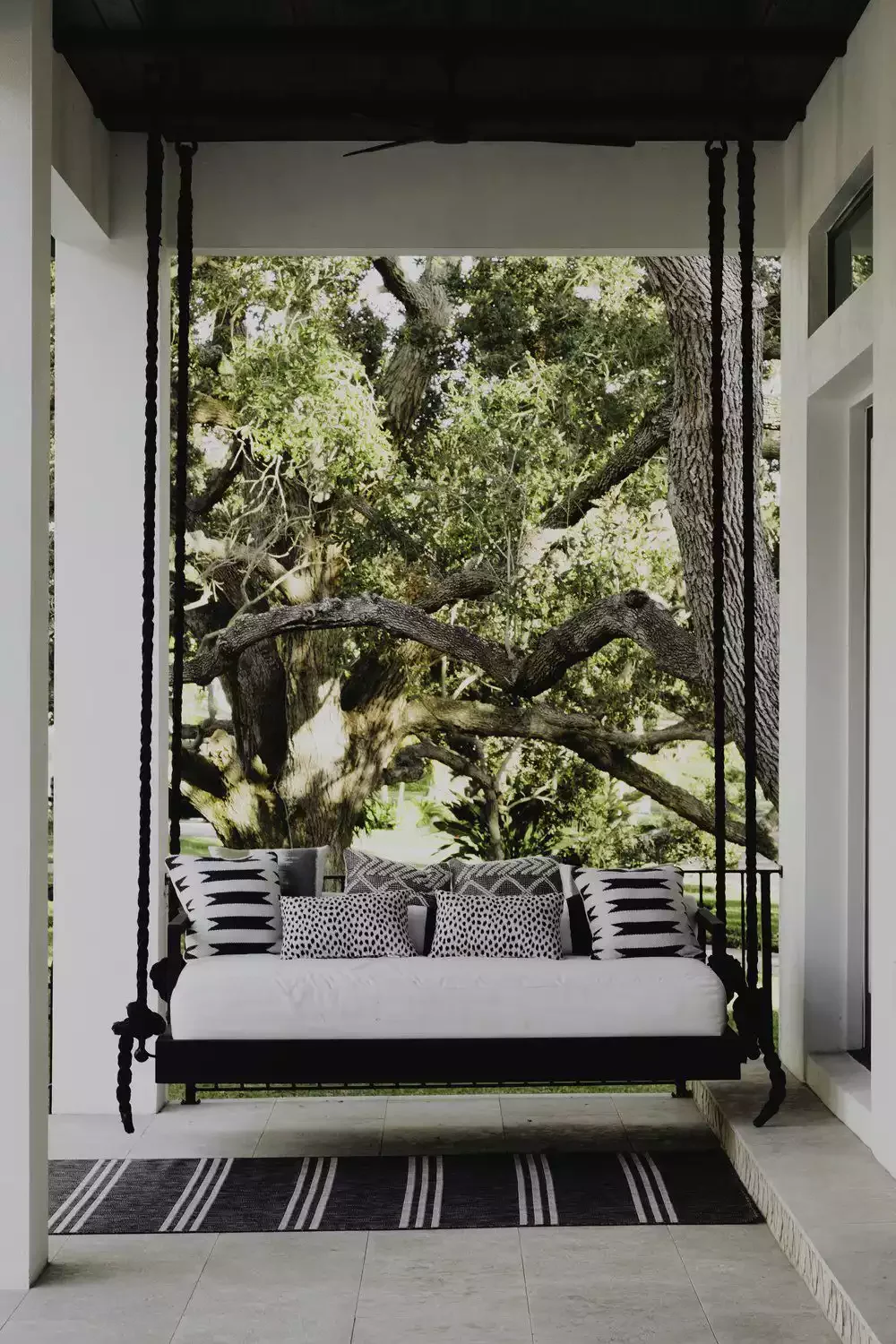 47 Stunning Modern Front Porch Ideas That Will Transform Your Home's Curb Appeal 1 Hang a Dramatic Porch Swing