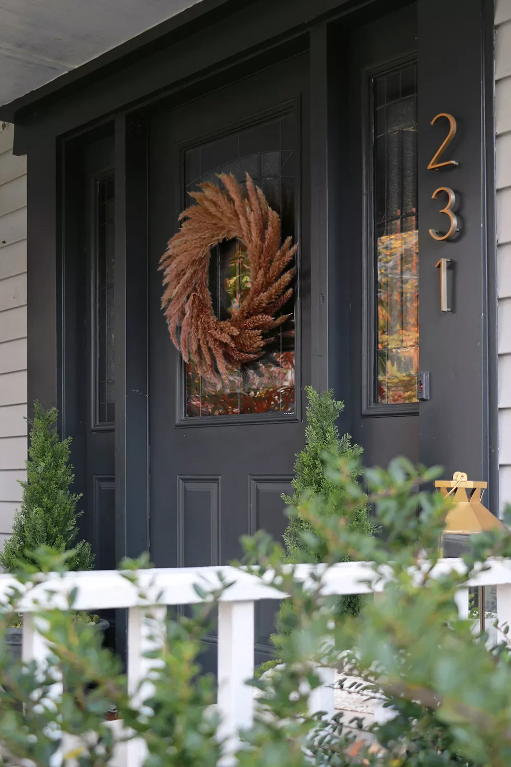 41 Beautiful Fall Outdoor Decorating Ideas to Transform Your Space This Season 37 Hang a Fluffy Fall Wreath