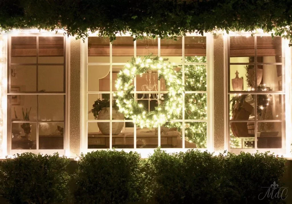 57 Stunning Outdoor Christmas Decorating Ideas That Will Transform Your Home's Holiday Curb Appeal 16 Hang a Giant Window Wreath