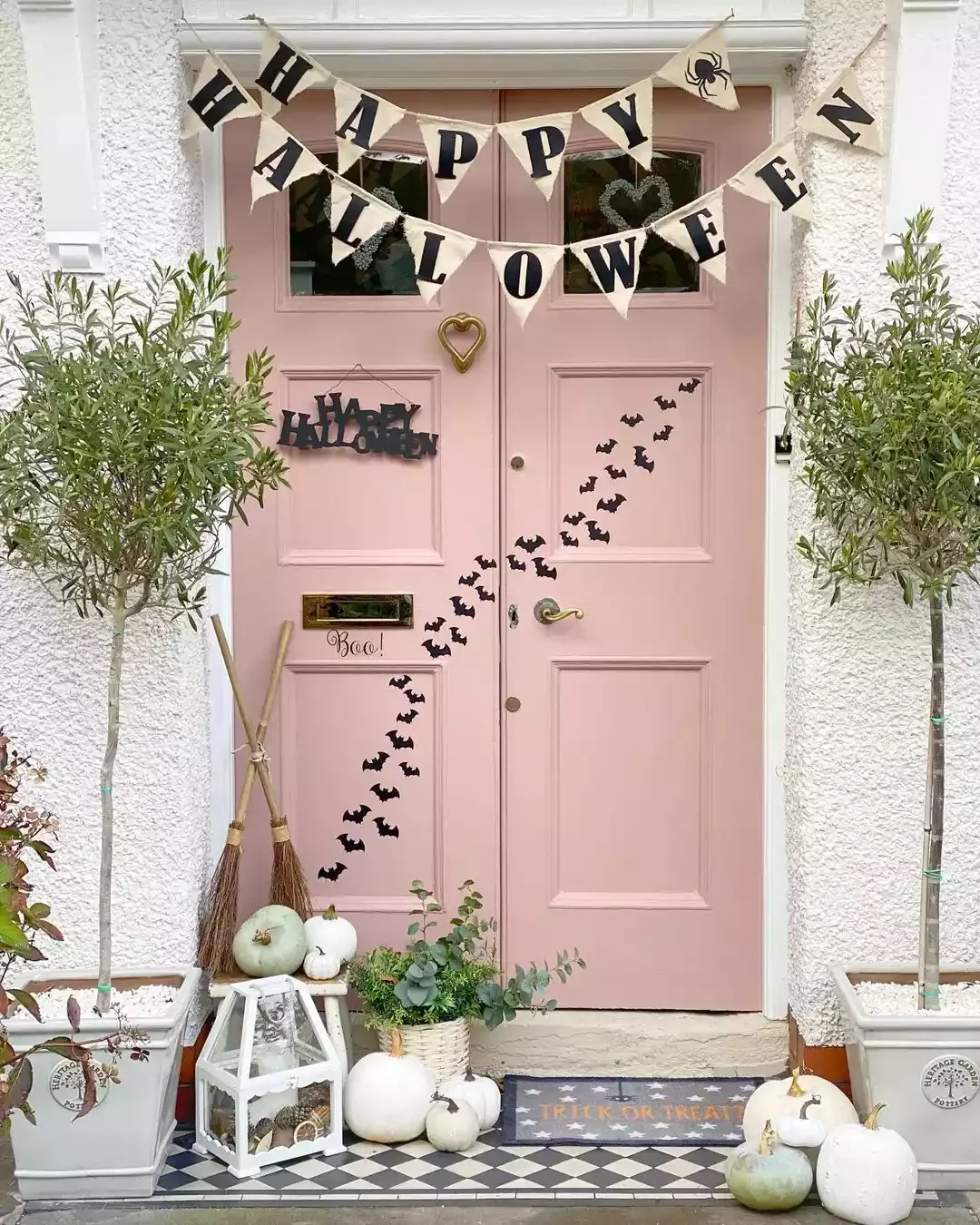 33 Spooktacular Halloween Front Porch Ideas That'll Make Your Home the Neighborhood's Must-See Destination 7 Hang a Halloween Banner