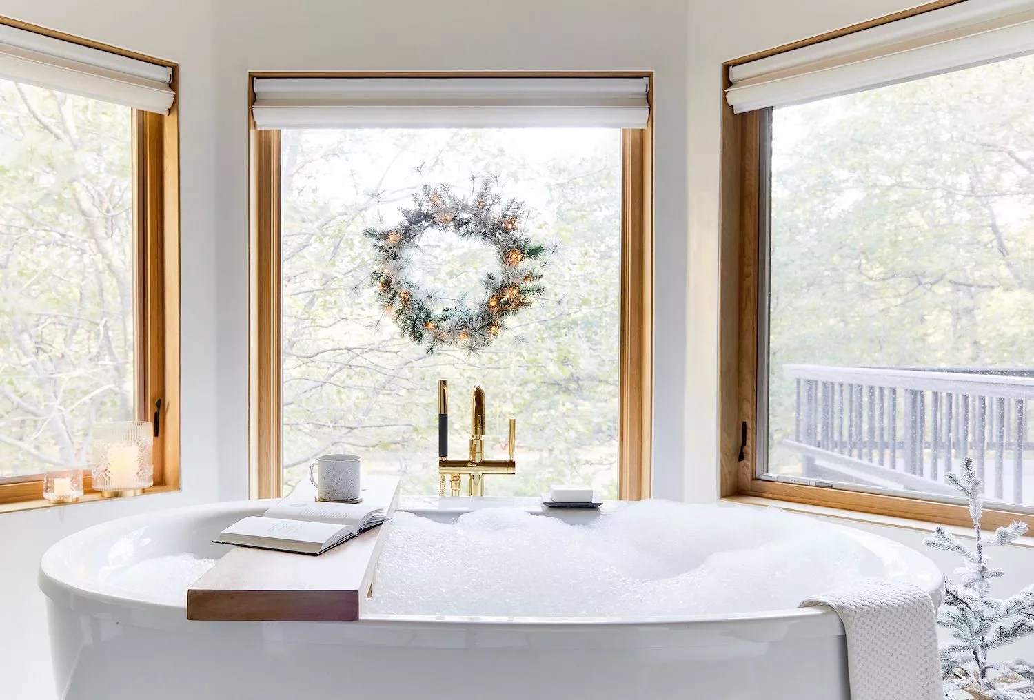 32 Christmas Bathroom Ideas That Create a Holiday Wonderland Hang a Pre-Lit Wreath