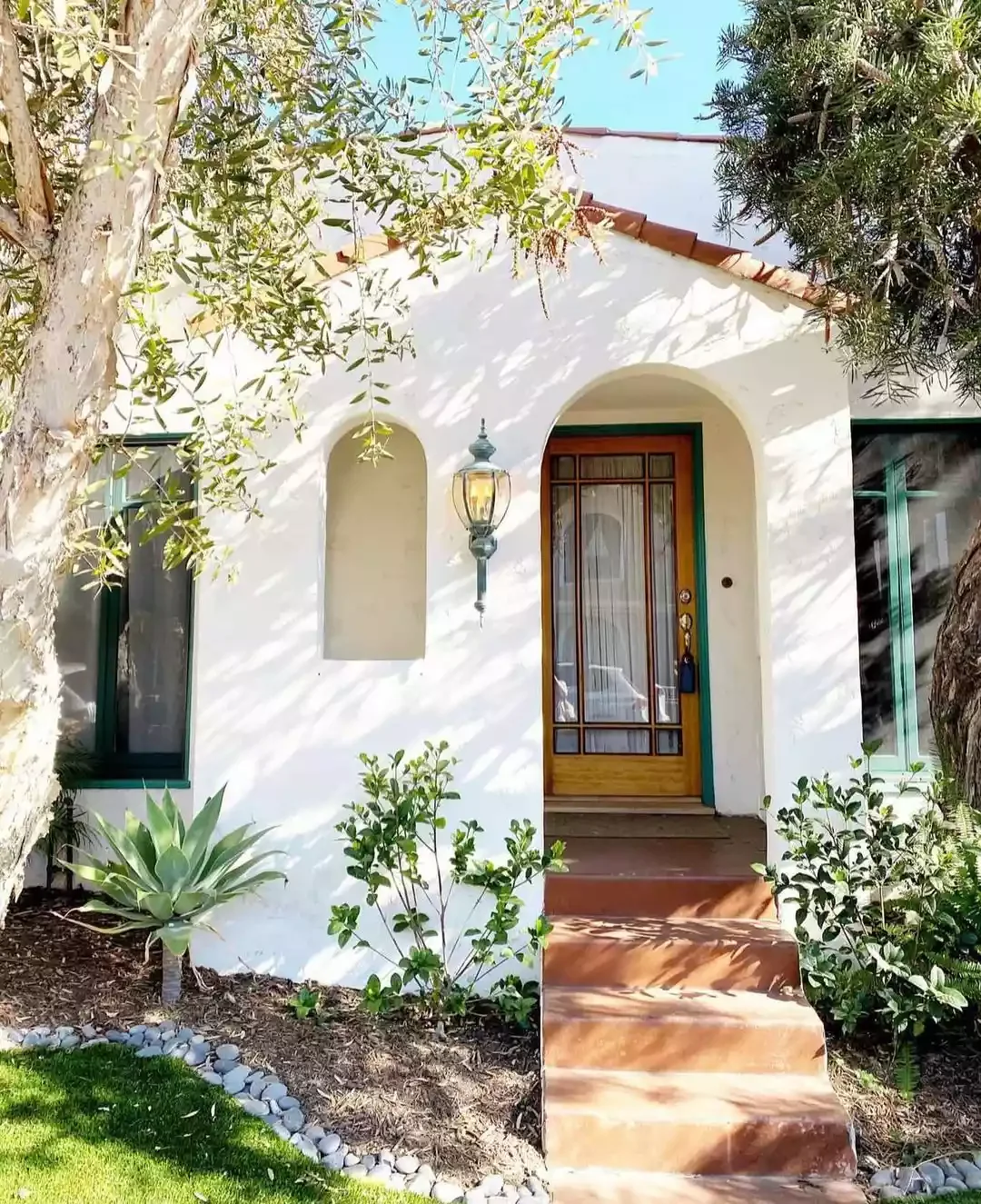 25 Stunning Front Porch Lighting Ideas to Transform Your Home's Entrance 1 Hang a Stylish Sconce