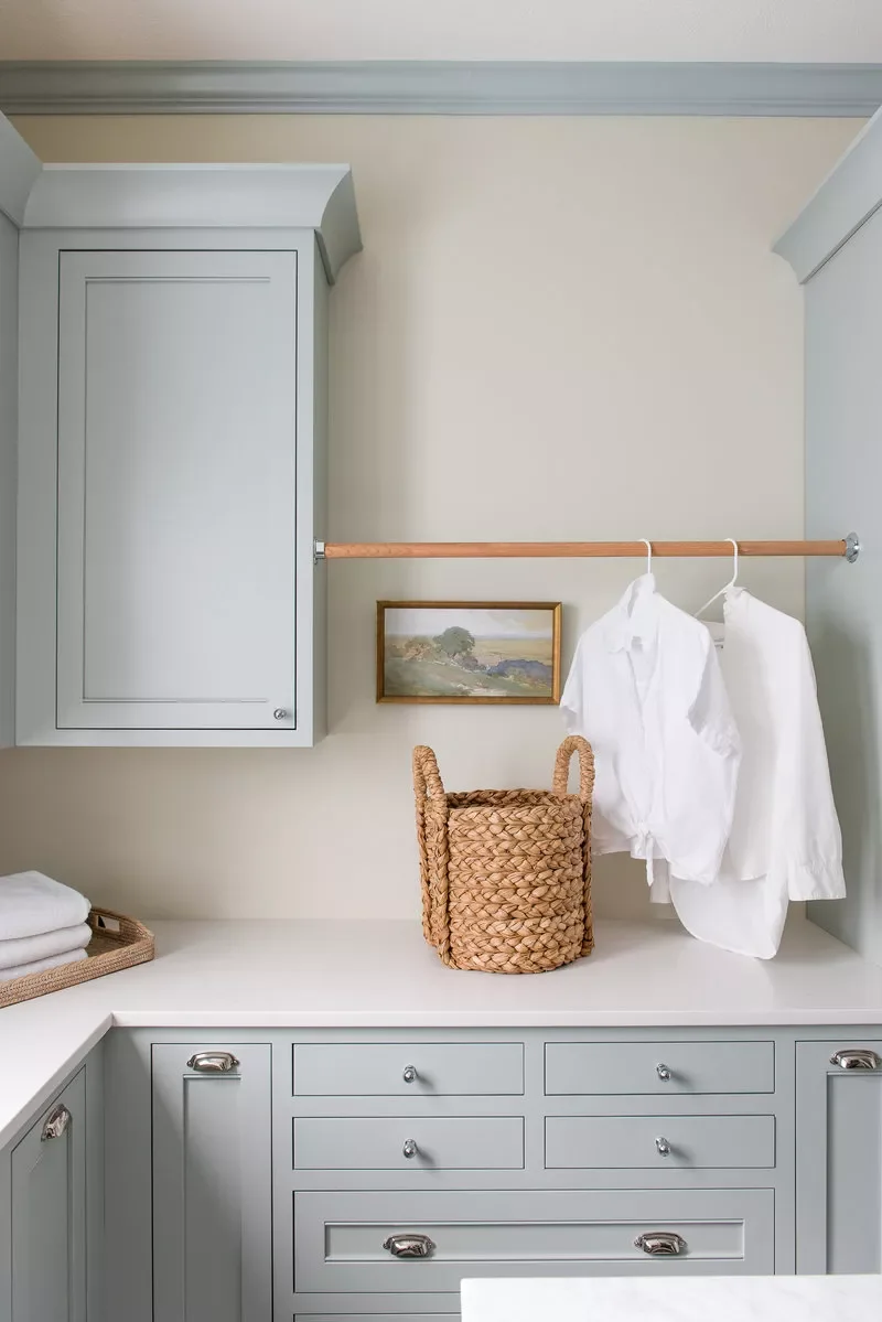 42 Brilliant Laundry Room Organization Solutions to Try This Season Hang a Wooden Rod