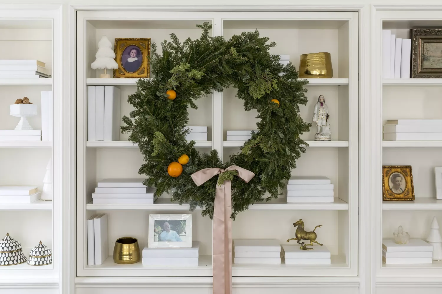 50 Christmas Decorating Ideas That Create a Designer Wonderland Hang a Wreath on Built-Ins