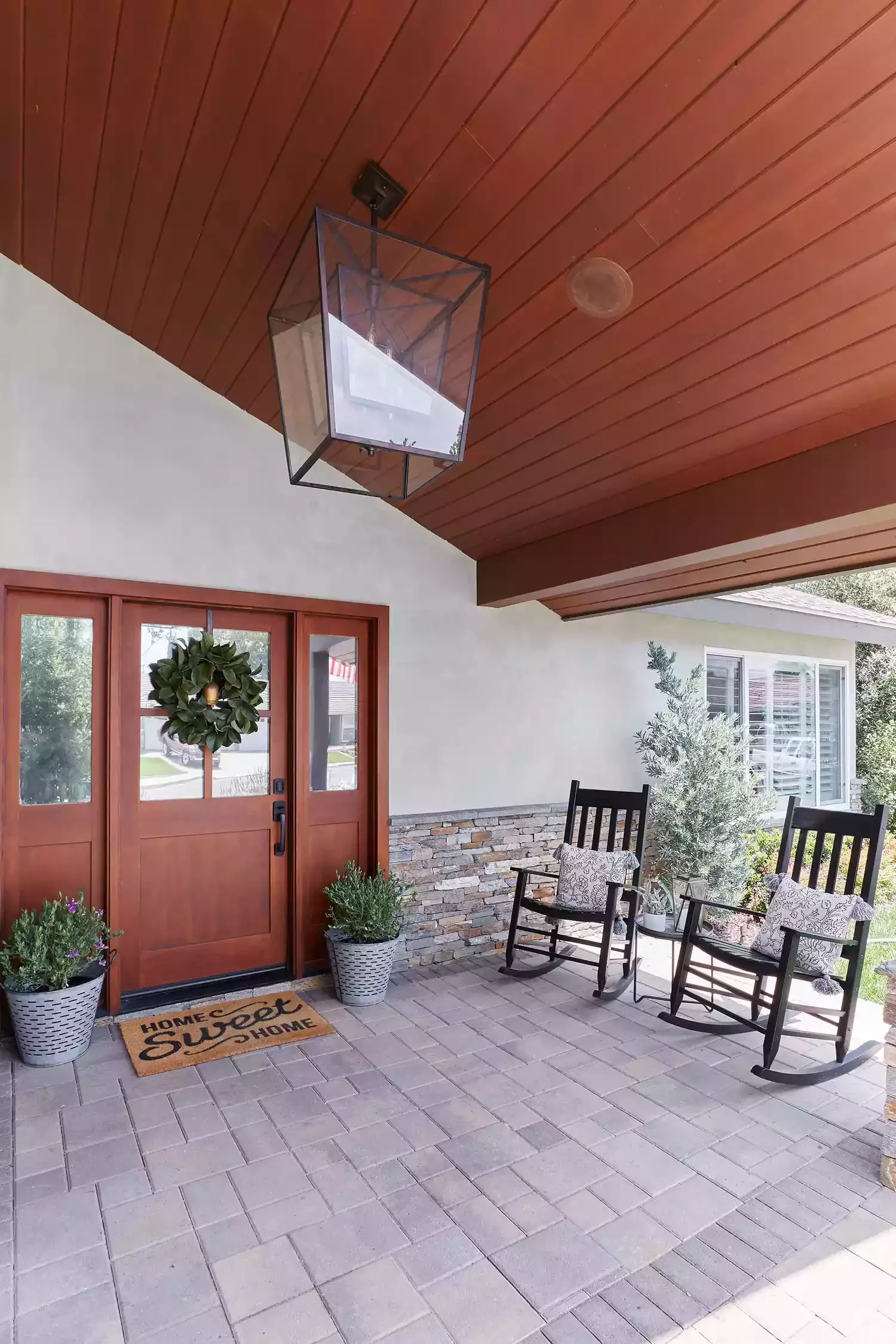 38 Charming Farmhouse Porch Ideas That Create the Perfect Welcome 26 Hang a Wreath