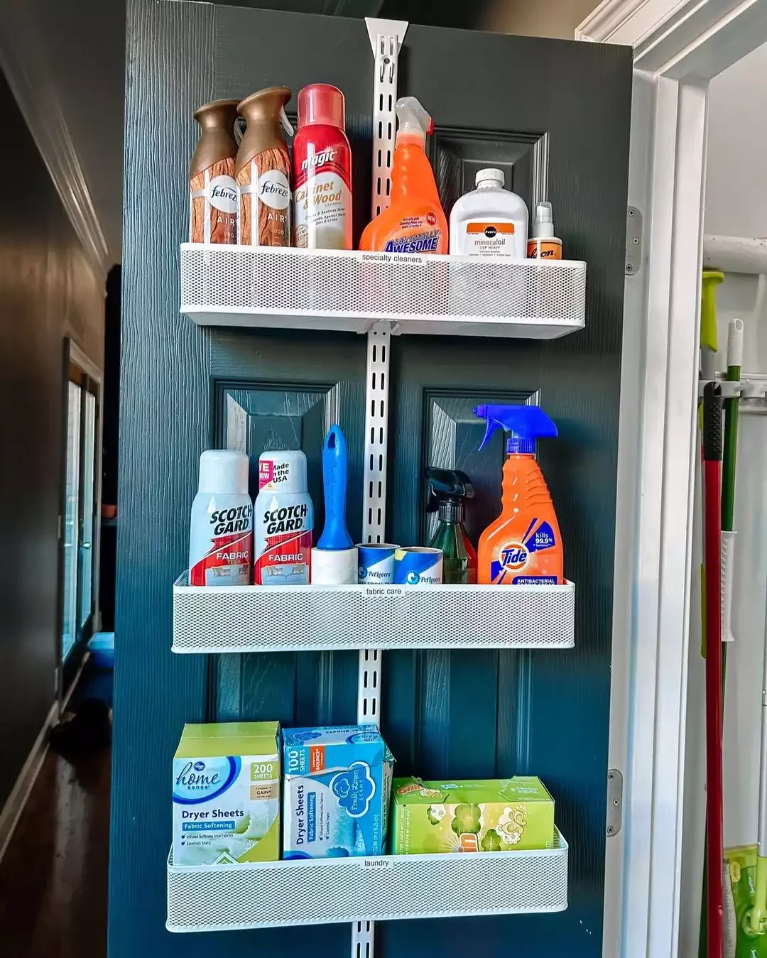42 Brilliant Laundry Room Organization Solutions to Try This Season Hang an Over-the-Door Rack