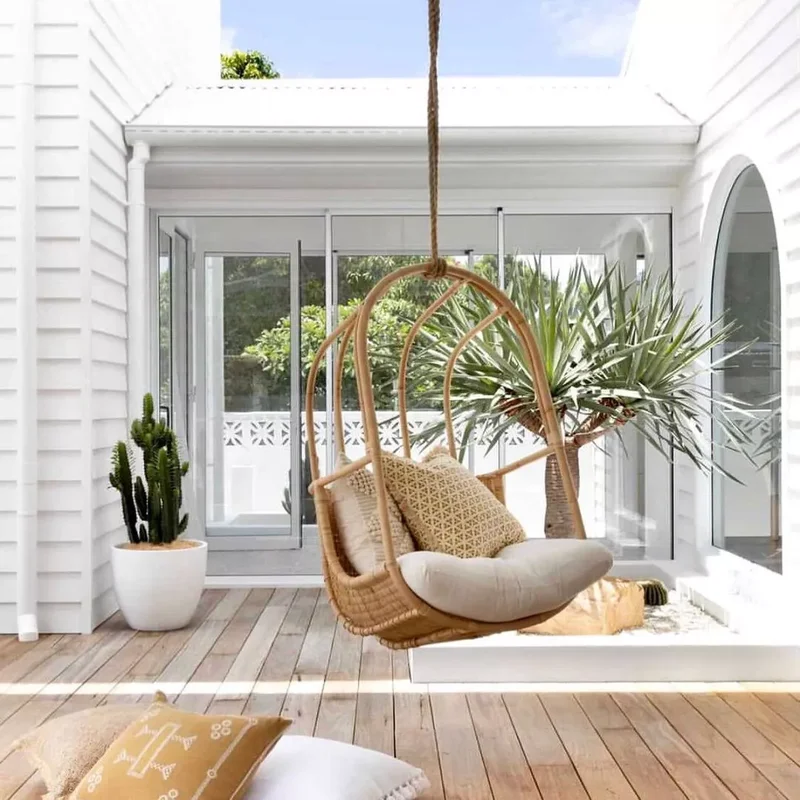 20 Groovy '70s Interior Design Trends Making a Comeback 1 Hanging Chairs