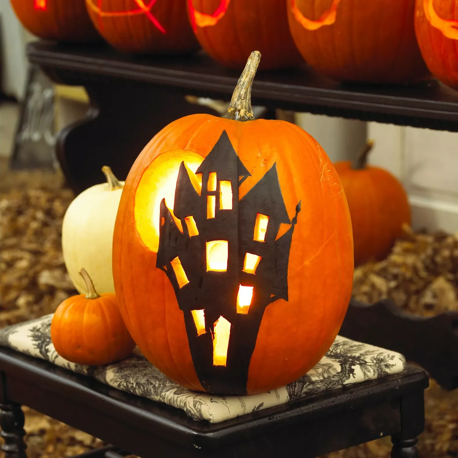 77 Creative Pumpkin Carving Ideas That'll Transform Your Fall Decorating Game 11 Haunted House Pumpkin