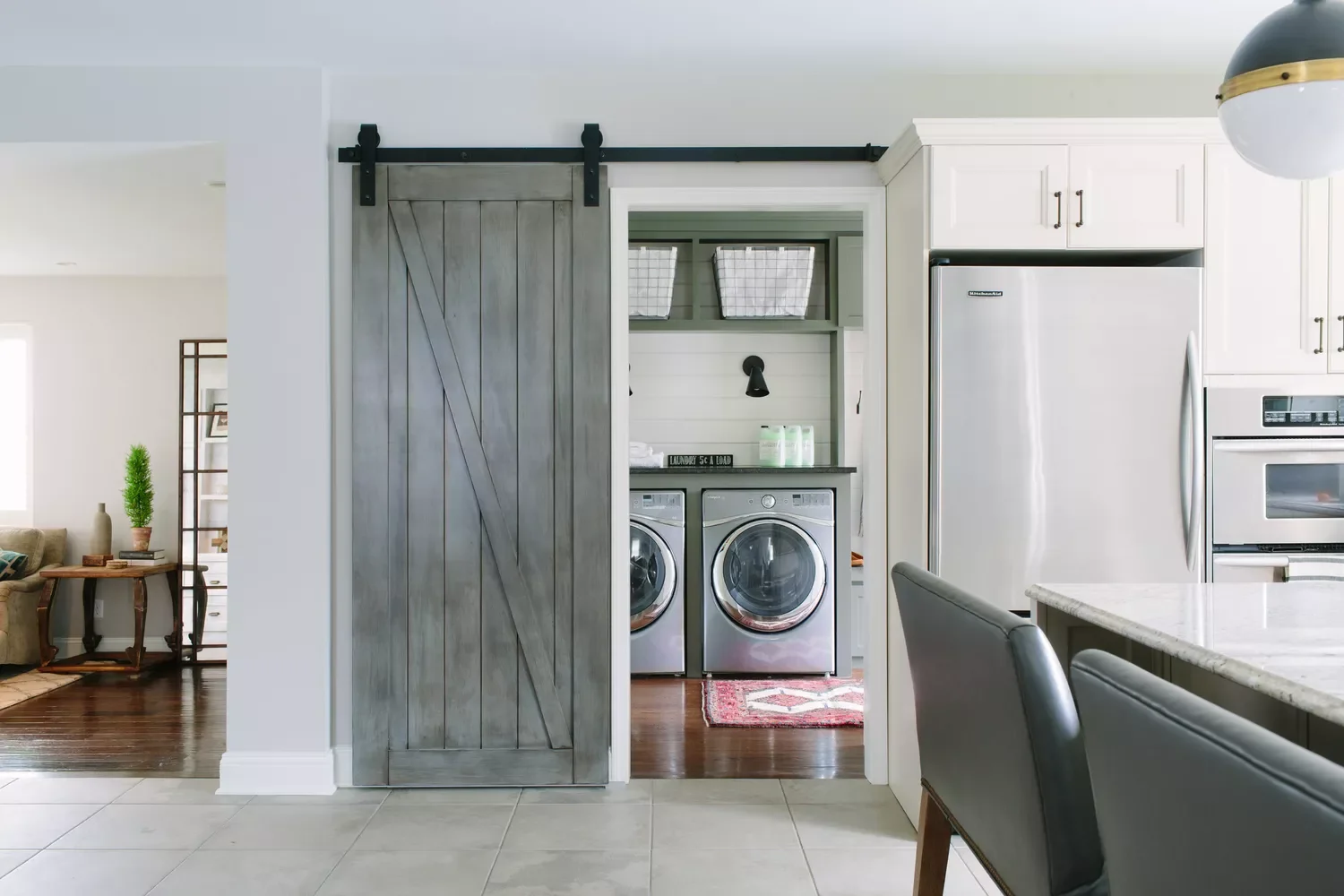 57 Creative Laundry Room Ideas That'll Make You Actually Enjoy Doing Chores Hide Behind a Barn Door