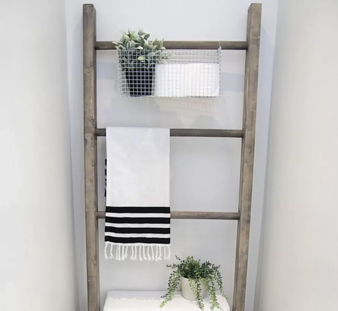 17 Brilliant Above-Toilet Storage Solutions That'll Transform Your Bathroom Hook a Bin to a Ladder