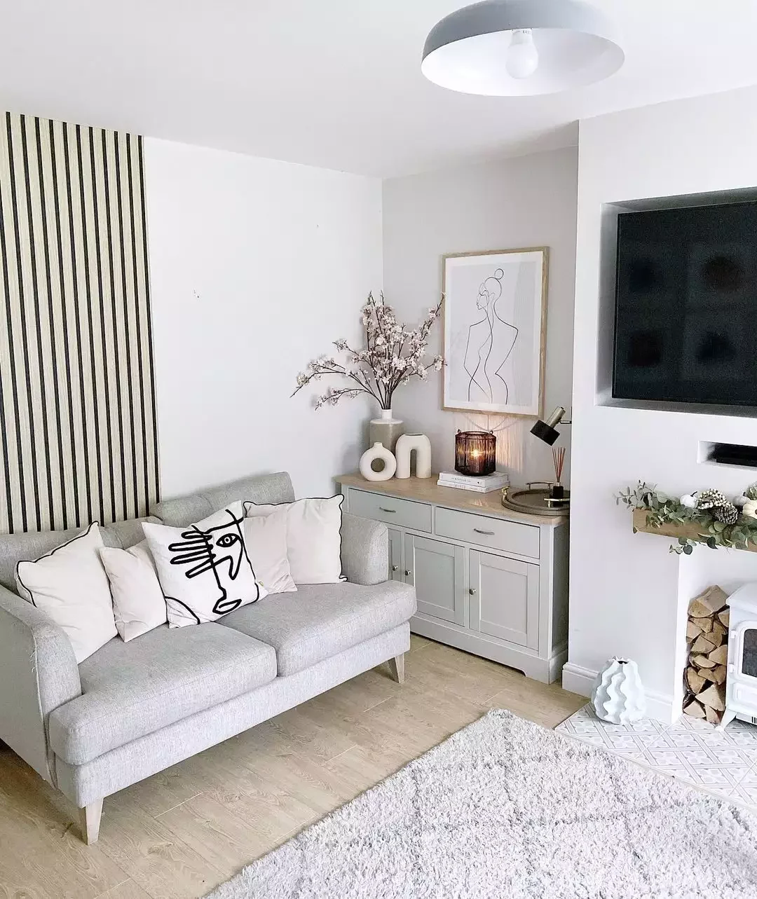 12 Beautiful Ways to Design a Cozy Minimalist Living Room 11 Incorporate Artistry