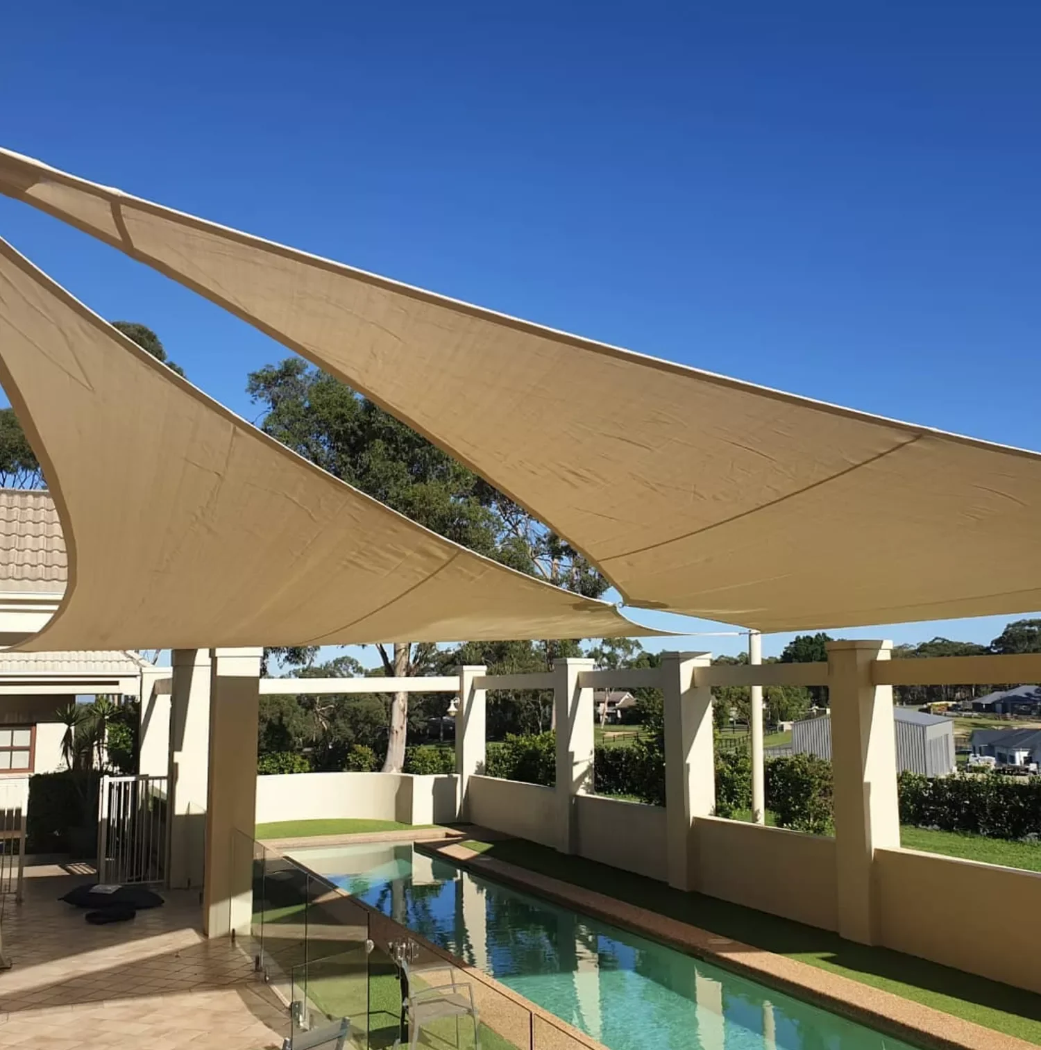 21 Creative Ways to Add Shade Around Your Pool Area 15 Install Twin Shade Sails