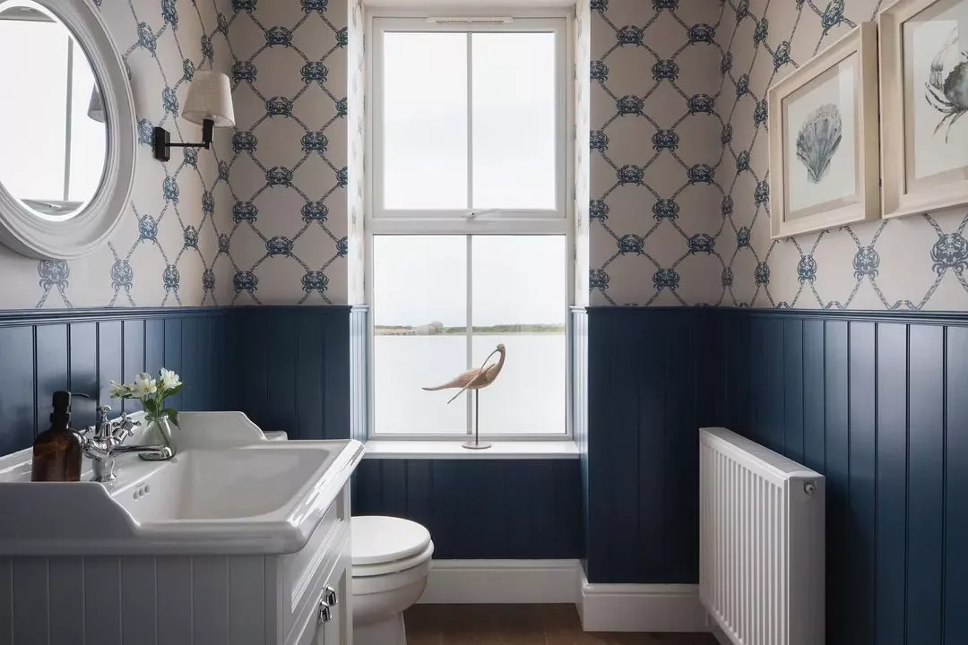 30 Beach-Inspired Bathroom Ideas That Bring Coastal Vibes Home 22 Install Whimsical Wallpaper