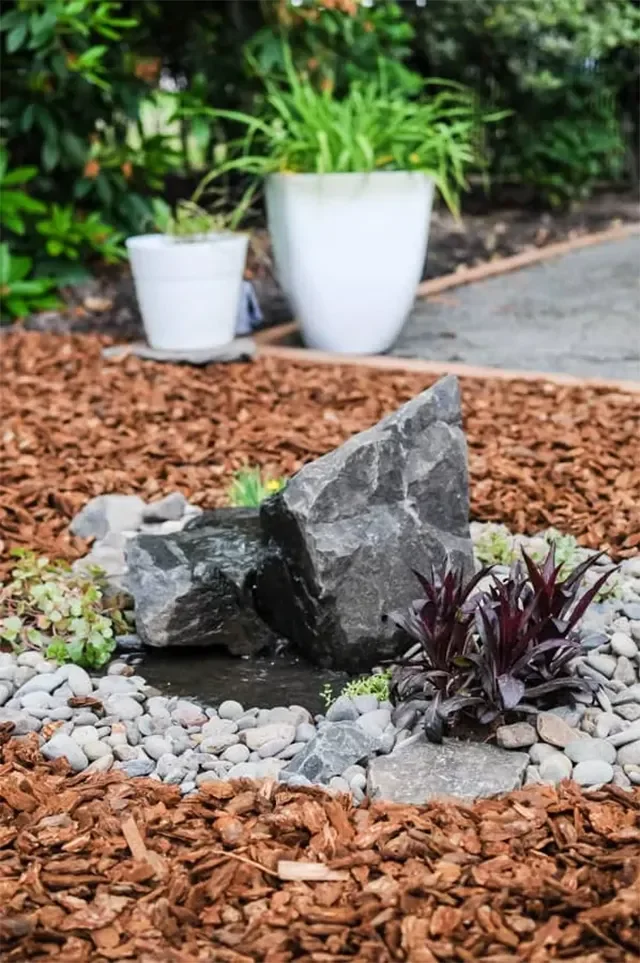 17 DIY Outdoor Decorating Projects to Transform Your Home's Landscape Install a DIY Rock Water Fountain