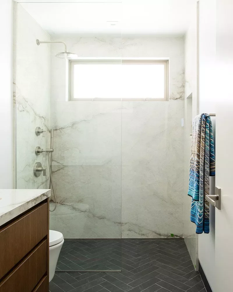 22 Clever Ways to Make Your Narrow Bathroom Feel Spacious and Stylish 21 Install a Glass Paritition
