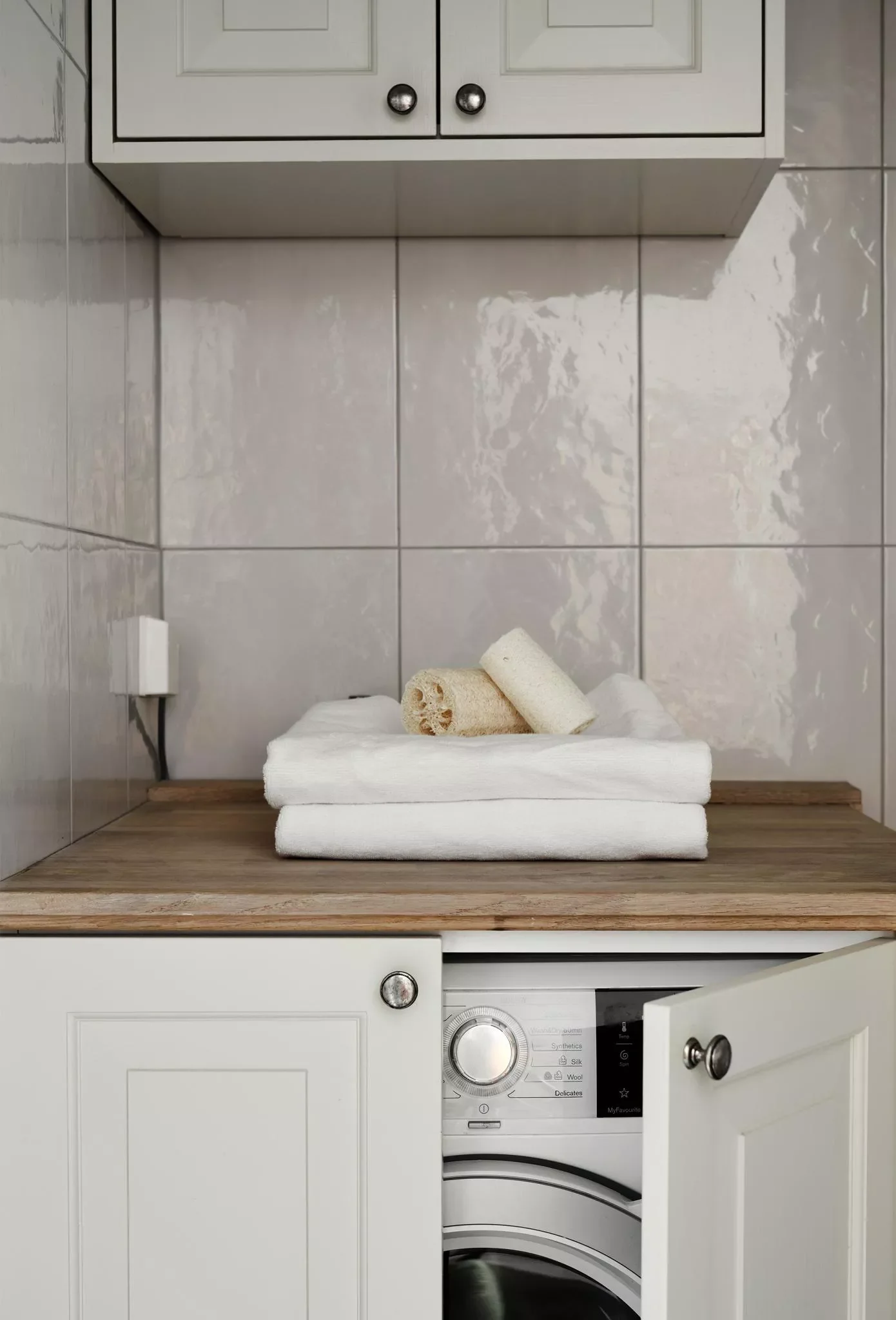 55 Small Laundry Room Ideas That Blend Style With Smart Functionality Install a Space-Saving Cabinet
