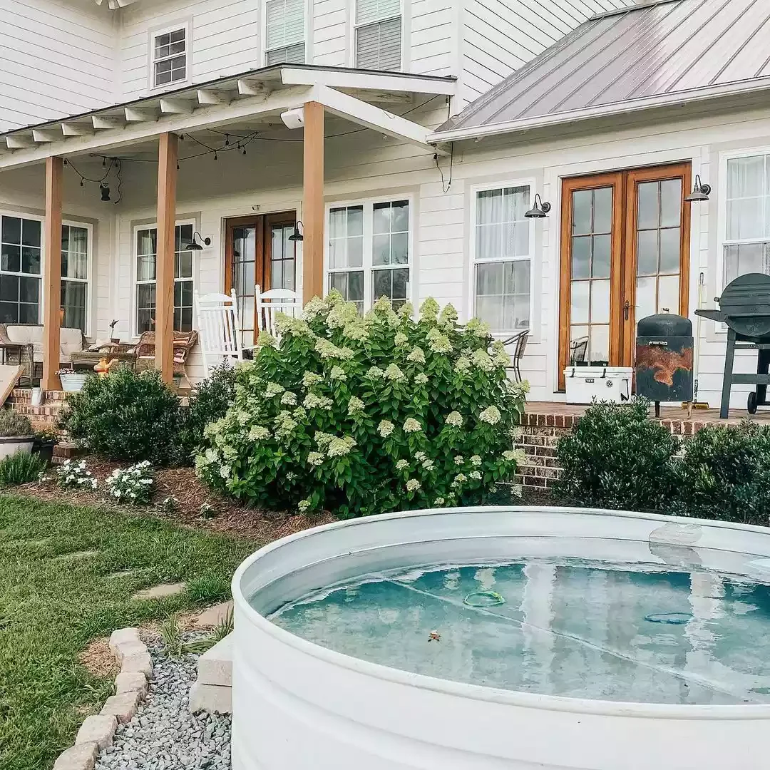 43 Budget-Friendly Backyard Makeover Ideas That Look Expensive 3 Install a Stock Tank Pool