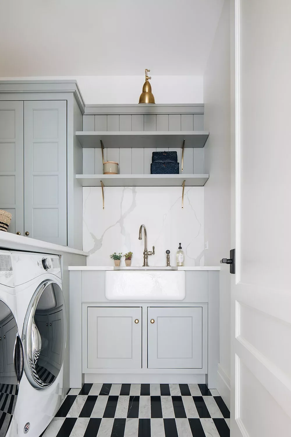 57 Creative Laundry Room Ideas That'll Make You Actually Enjoy Doing Chores Install a Tall Backsplash