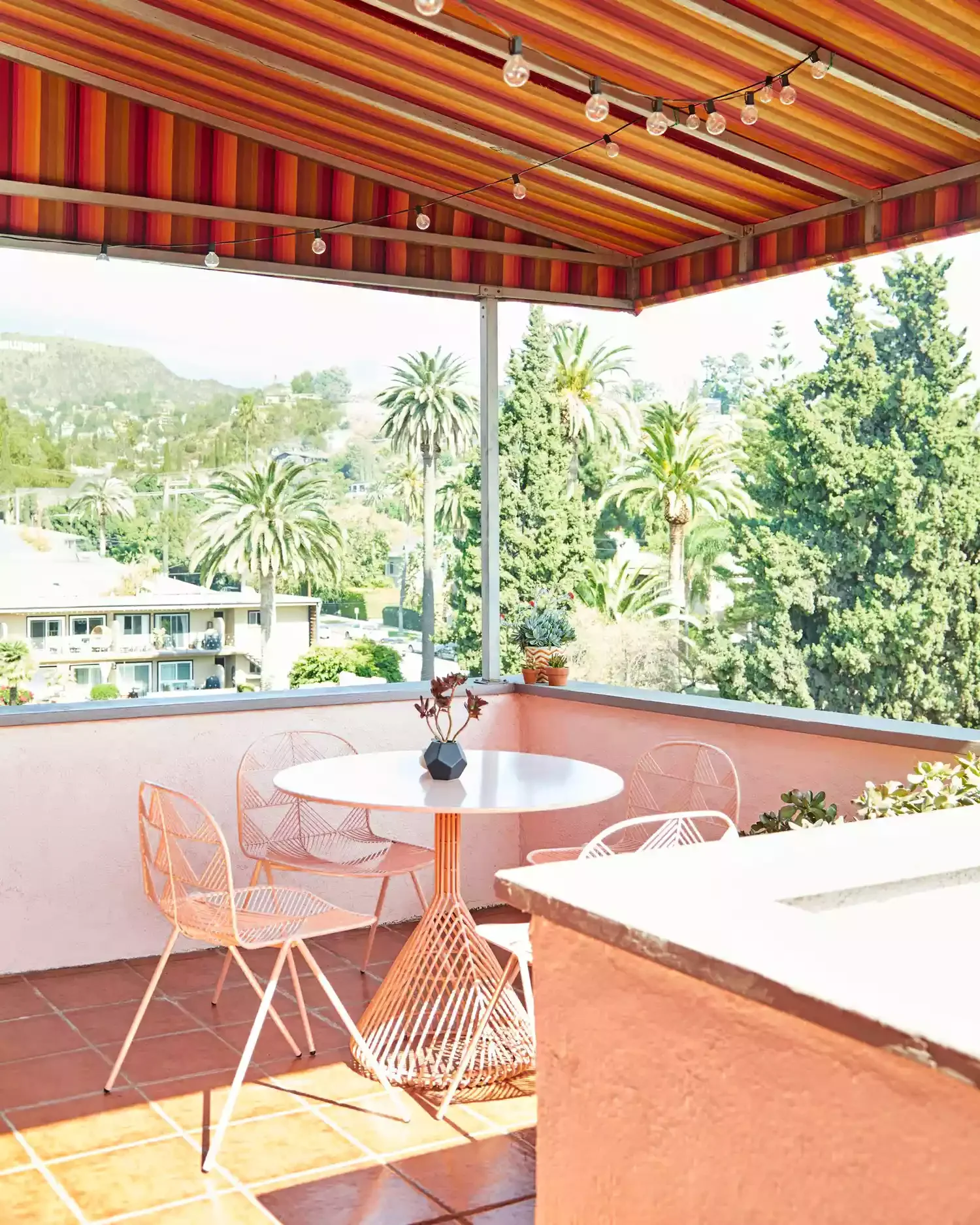 21 Creative Ways to Transform Your Apartment Patio Into an Outdoor Haven 16 Install an Awning