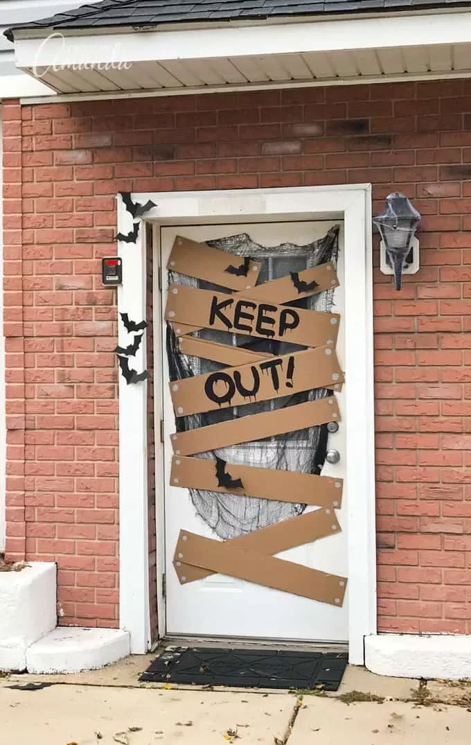 42 Quick Halloween Door Decorations You Can Create in Under an Hour 13 Keep Out Door Sign sgfi8