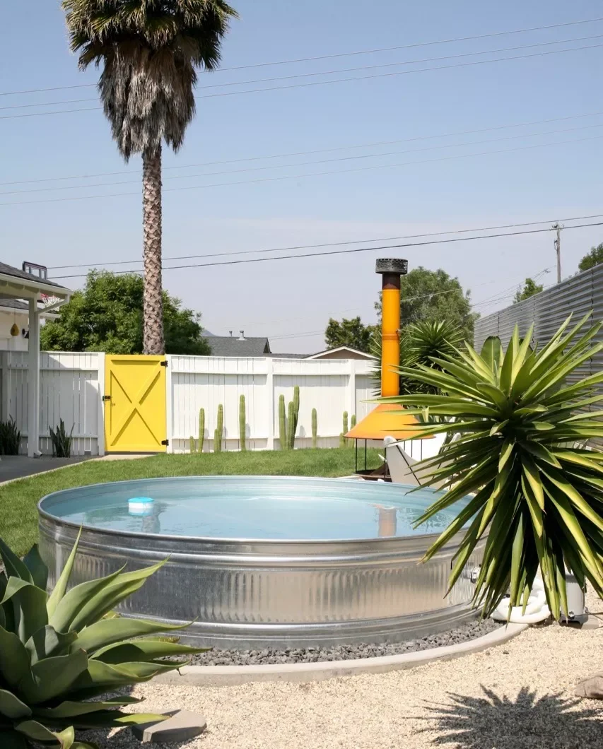 33 Creative Stock Tank Pool Ideas to Transform Your Backyard 5 Keep Things Cohesive
