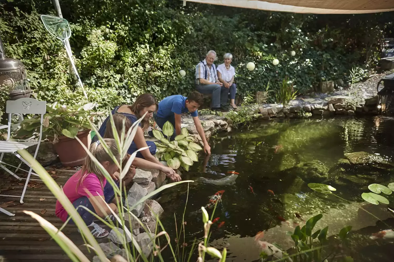 24 Beautiful Koi Pond Designs to Transform Your Outdoor Space Koi Pond With Viewing Trail