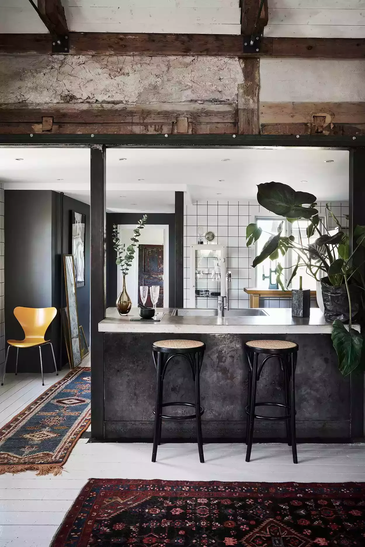31 Bohemian Kitchen Ideas That Will Transform Your Space with Personality 26 Layer Rugs and Art