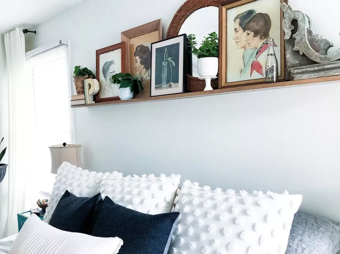 25 Charming Ways to Create Your Dream Vintage-Style Bedroom 22 Layer Some Portraits
