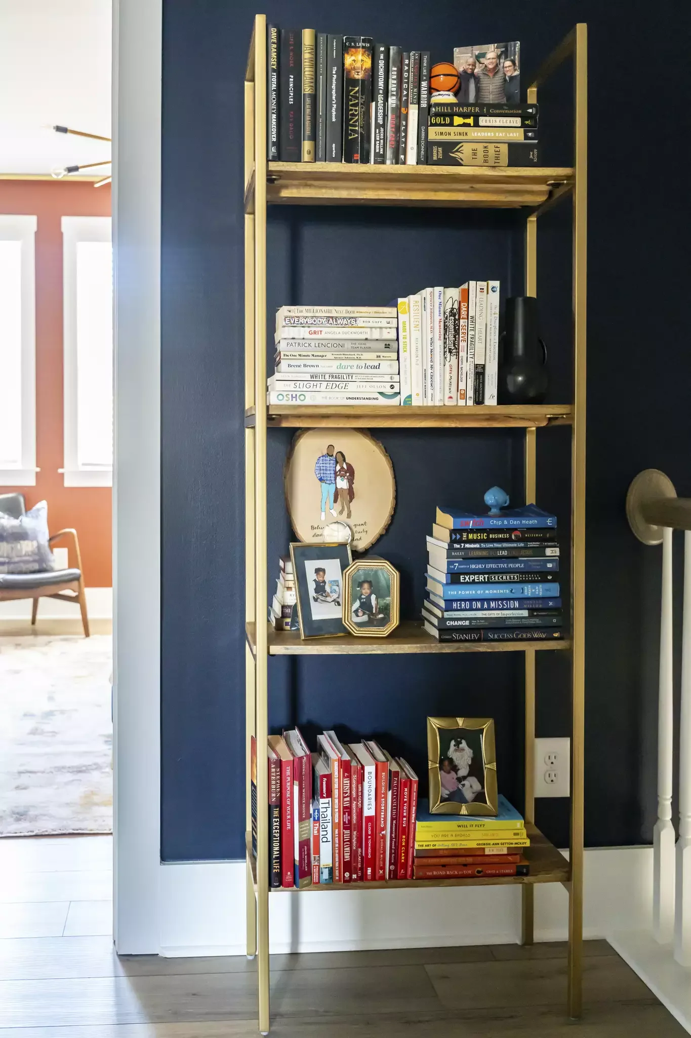 51 Creative Bookshelf Styling Ideas That Transform Your Space 31 Layer in Frames