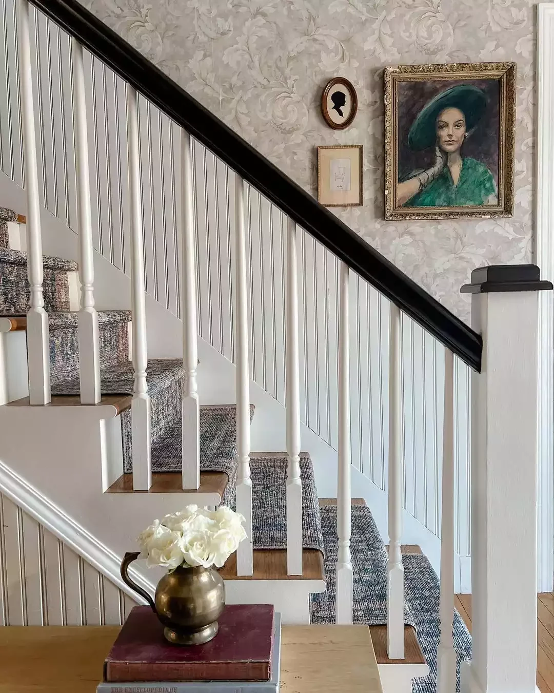 30 Creative Staircase Wall Decorating Ideas That Will Transform Your Space 18 Let a Portrait Shine