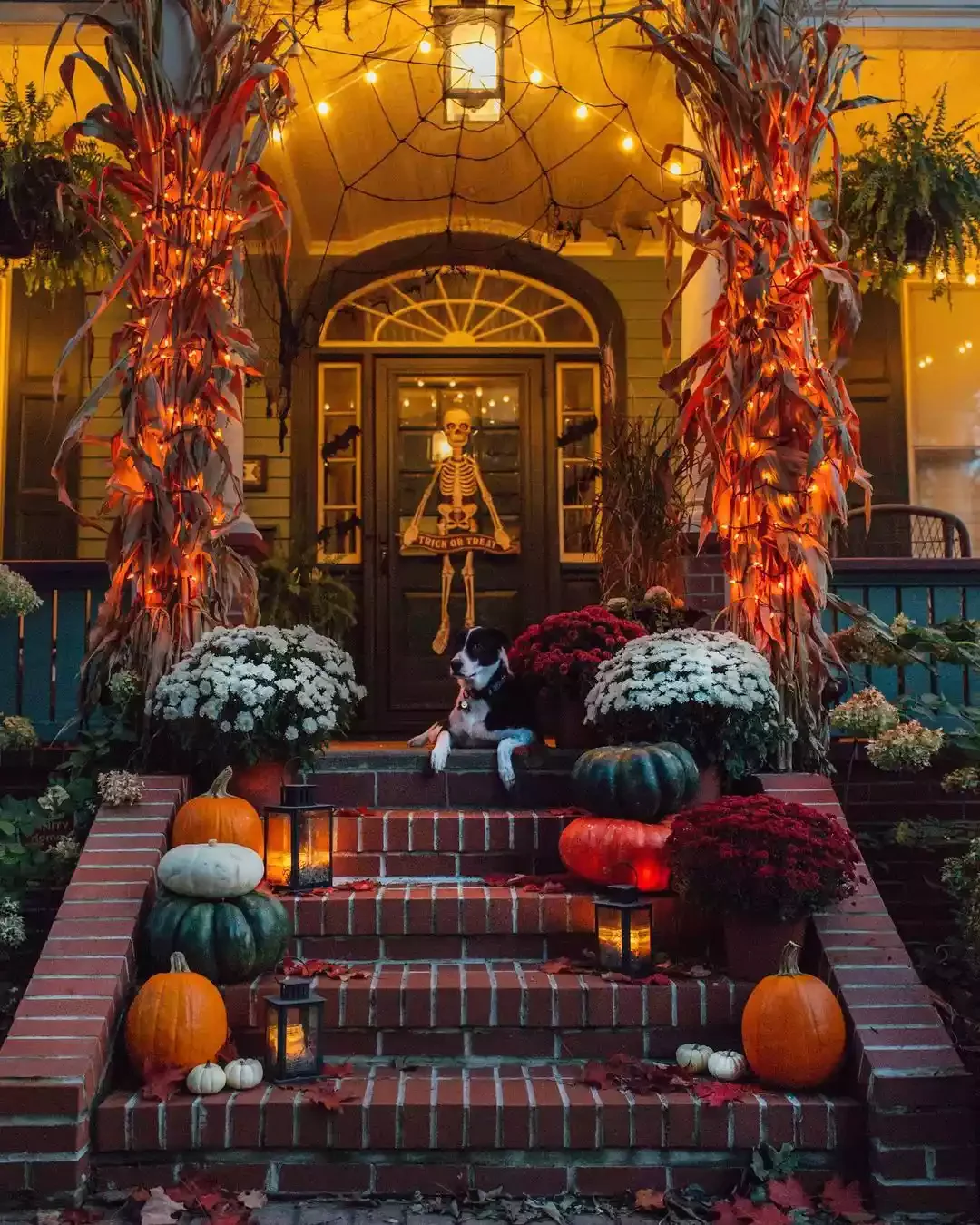 33 Spooktacular Halloween Front Porch Ideas That'll Make Your Home the Neighborhood's Must-See Destination 24 Light Your Corn Stalks