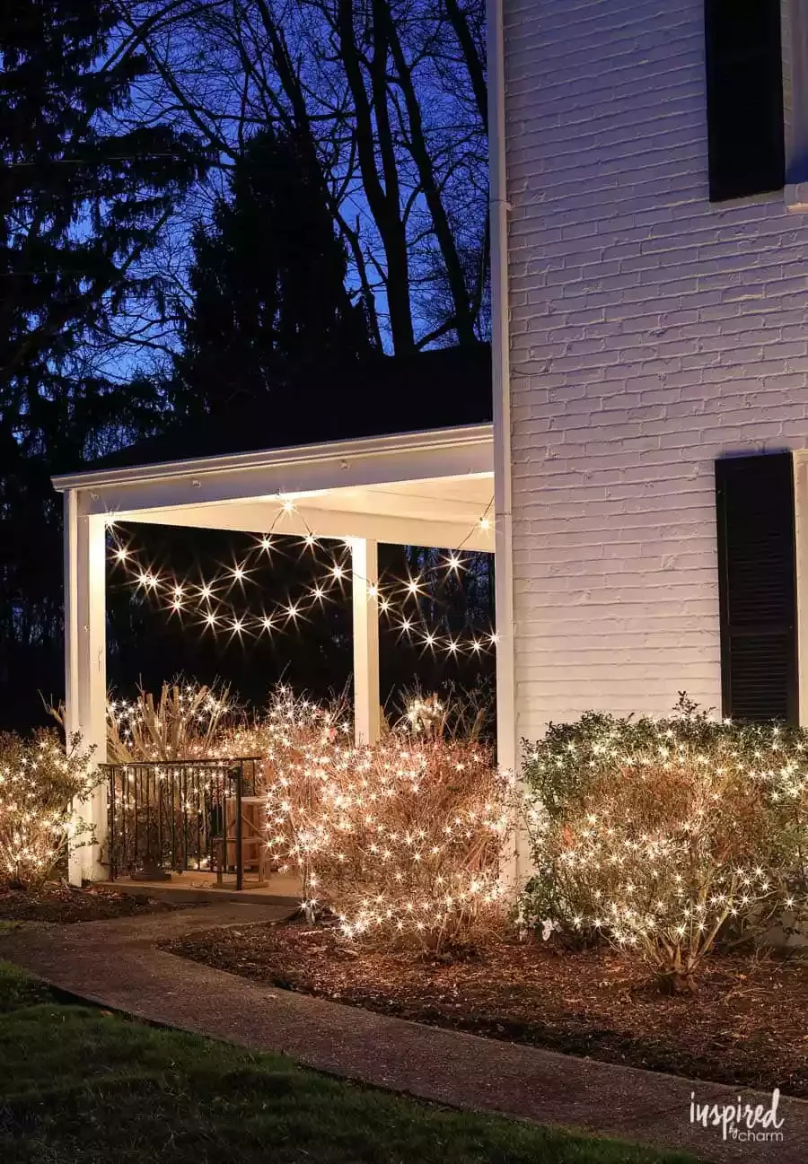 57 Stunning Outdoor Christmas Decorating Ideas That Will Transform Your Home's Holiday Curb Appeal 18 Light the Bushes