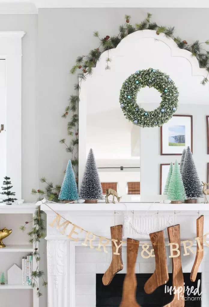 56 Magical Christmas Mantel Decorating Ideas to Transform Your Holiday Home 42 Line Up Bottle Brush Trees