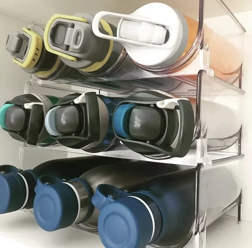 12 Clever Ways to Organize Your Water Bottle Collection Line Up Bottles in Slim Containers