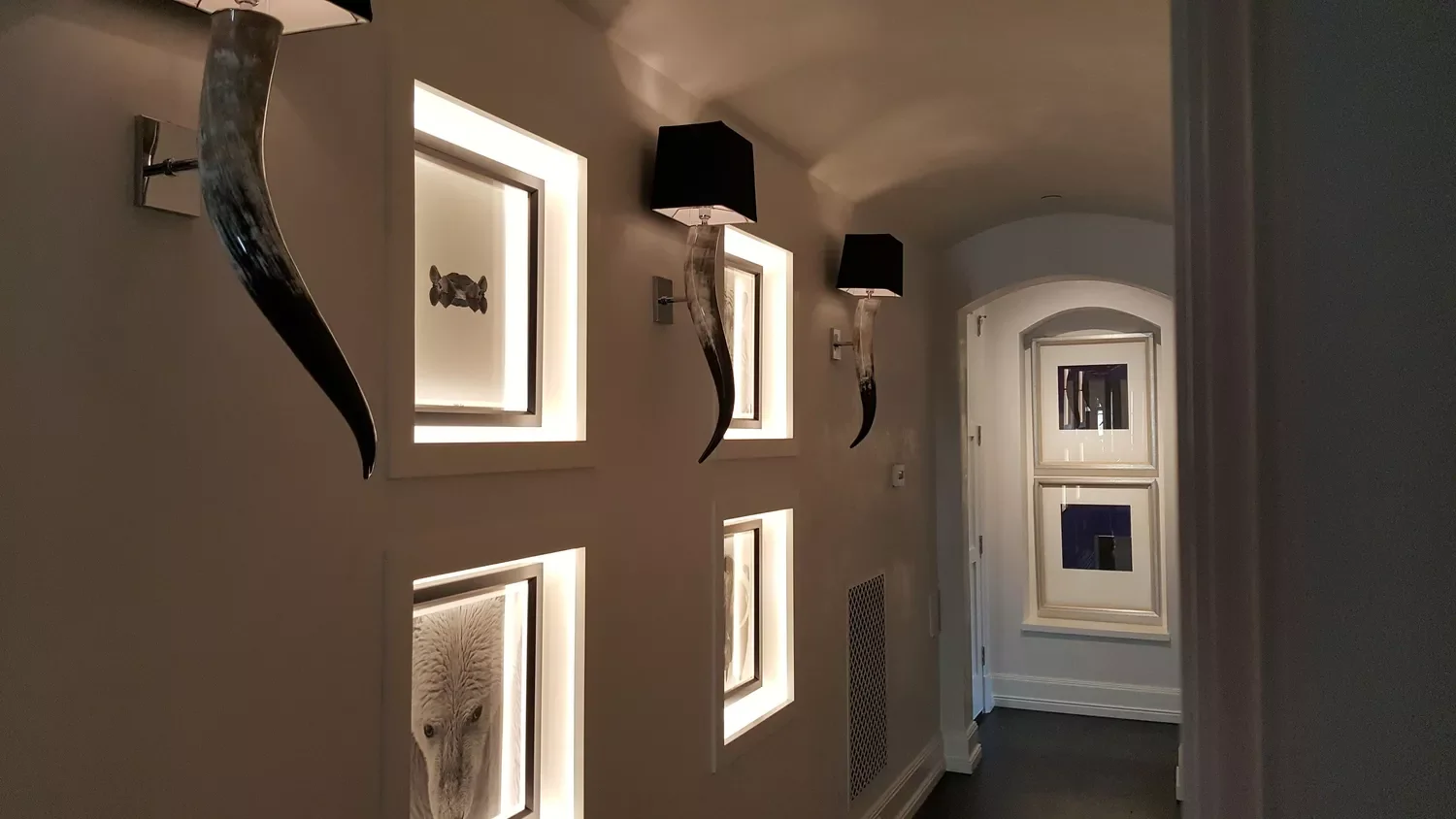 26 Stunning Hallway Decorating Ideas to Transform Your Home's Passageways 7 Line Up Some Sconces
