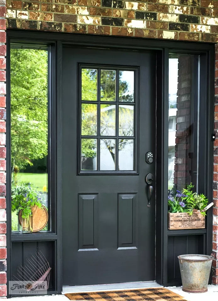 33 Stunning Black Front Door Ideas That Transform Your Home's Entrance Make a Black Door Nice and Sweet With Flowers