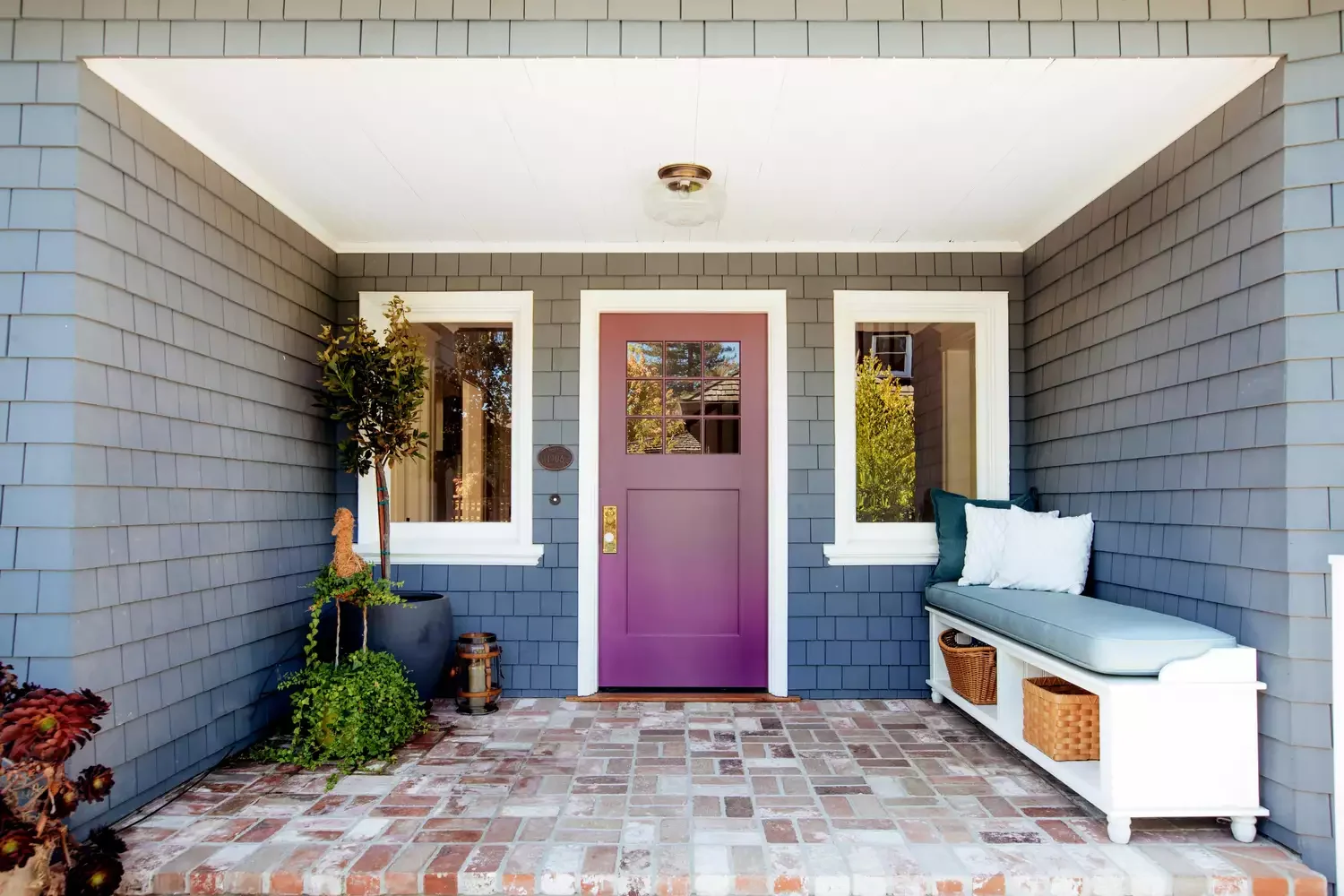 21 Budget-Friendly Small Porch Ideas That Will Make Your Neighbors Jealous 13 Make a Statement With Color