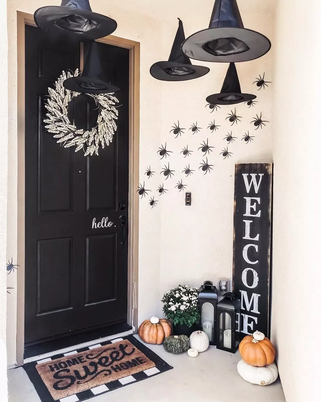 33 Spooktacular Halloween Front Porch Ideas That'll Make Your Home the Neighborhood's Must-See Destination 27 Make a Trail of Spiders