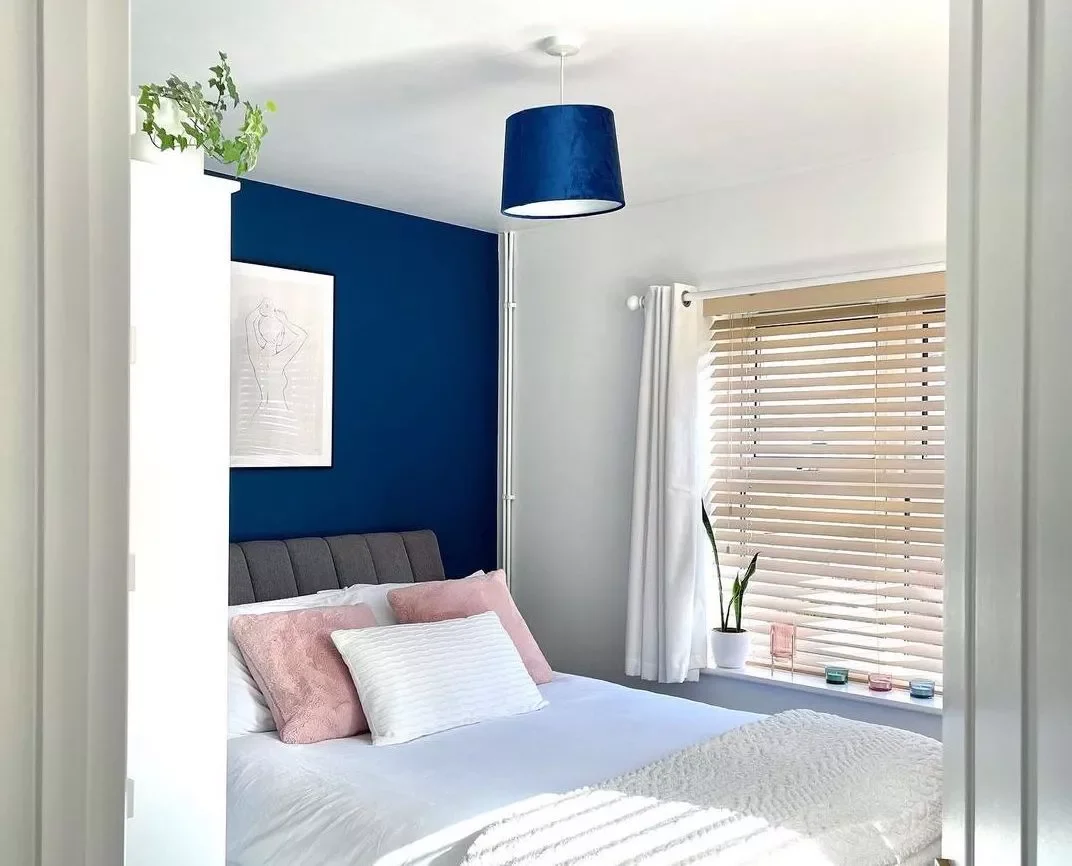25 Stunning Navy Blue Bedroom Ideas That Will Transform Your Space 8 Match Your Light Fixtures to Your Walls