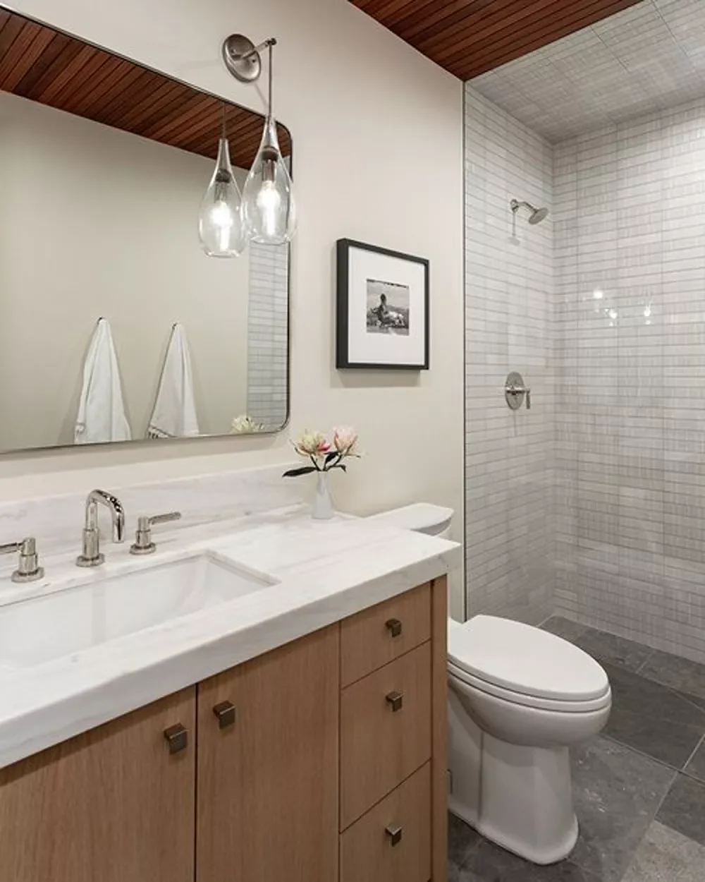 30 Stunning Corner Shower Designs to Elevate Your Bathroom 1 Minimalist Corner Shower