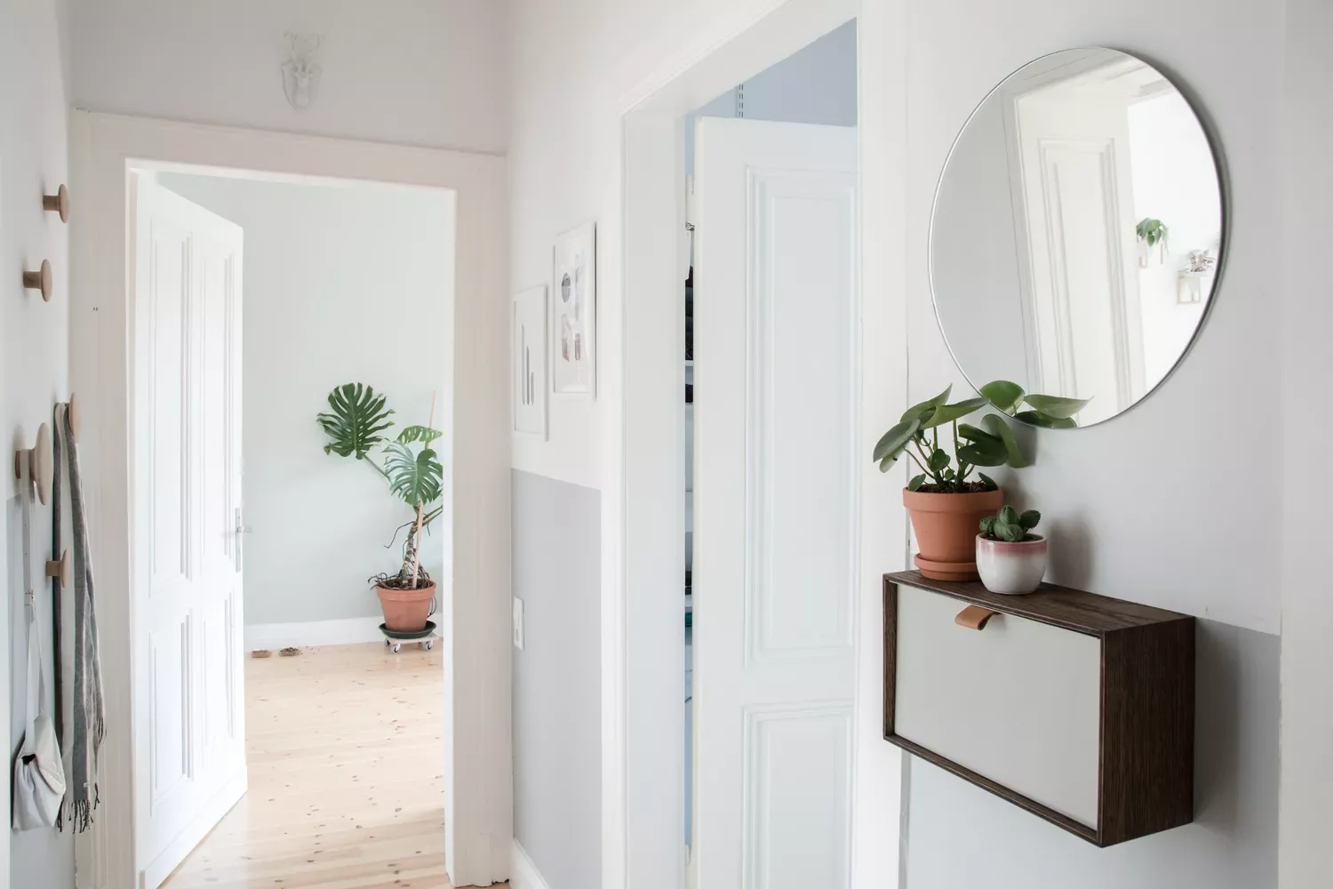 22 Breathtaking Entryway Designs That Create Stunning First Impressions 22 Minimalist Entryway With Pops of Greenery