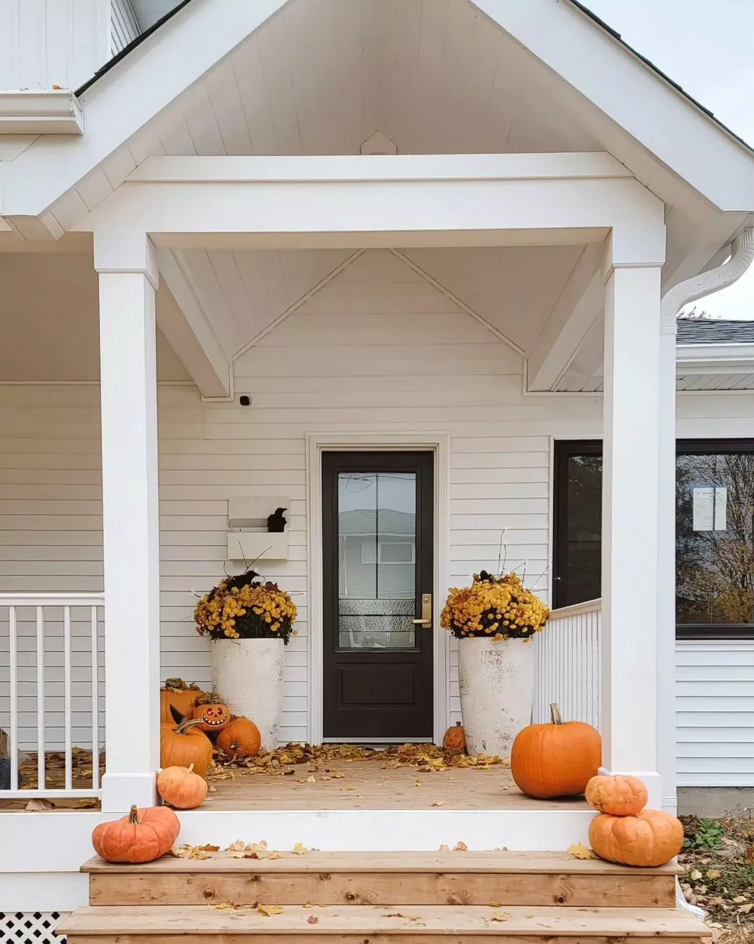 41 Beautiful Fall Outdoor Decorating Ideas to Transform Your Space This Season 1 Mix Pumpkins and Mums By the Door